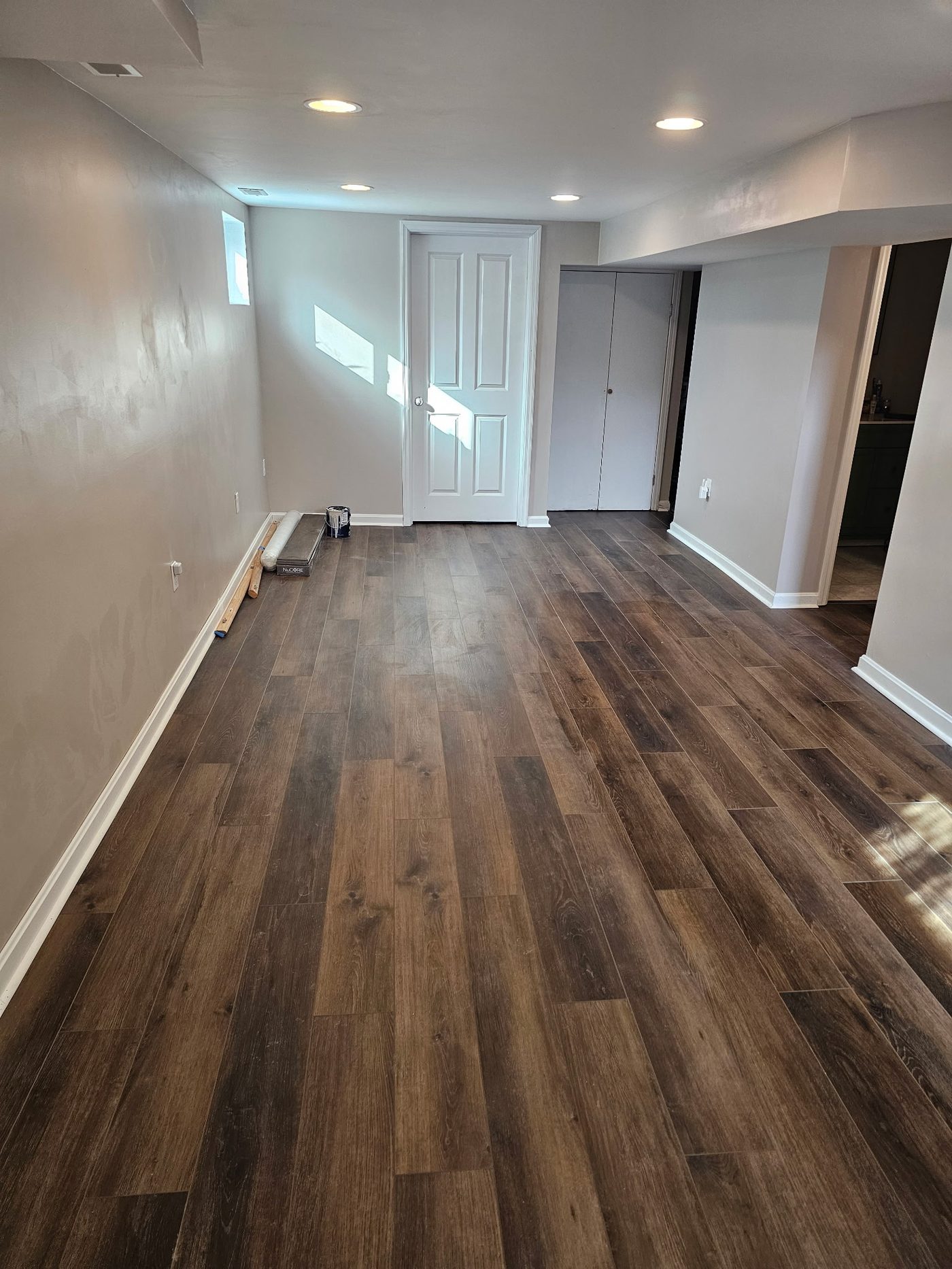 Finished basement remodel with new flooring